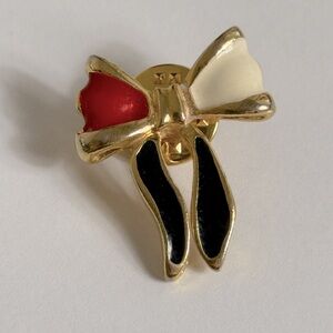 Elegant Vintage Gold Bow Brooch with Red, Black, and White Accents